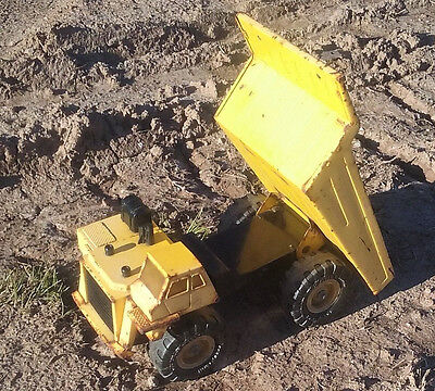 Yellow Metal Dump Truck Goodyear Super Terra Grip Tires 1986 REMCO Toys, Inc.