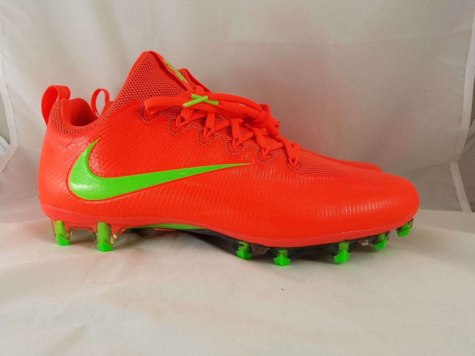 orange and green football cleats