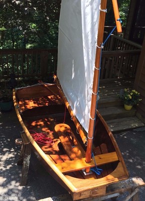 Mahogany wooden sailing and row boat dinghy