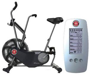 What size button battery is used in a Schwinn DX900 stationary bike?