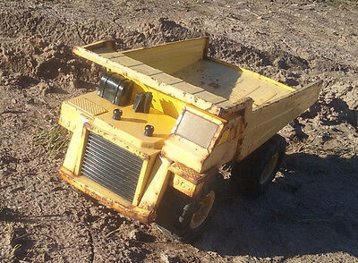 Yellow Metal Dump Truck Goodyear Super Terra Grip Tires 1986 REMCO Toys, Inc.