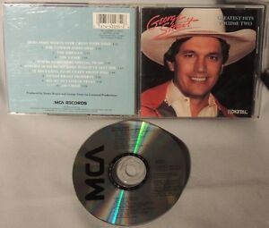 What are some of George Strait's greatest hits?