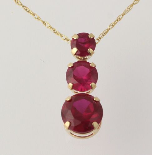10k Yellow Gold Three-Stone NEW 2.40ctw Synthetic Ruby Journey Pendant Necklace