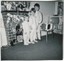 1950s-Vintage-Photo-Kids-in-Footy-PJs-by-Christmas-Stockings-on-Fake-Fire-Place