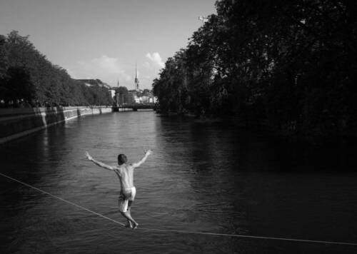 Man Tightrope Walking Over River Old Photo