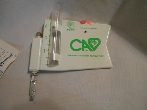 New old stock C A inc Agriculture with green rooster weathervane rain gauge