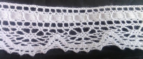 1 yard of pure white crochet with an inserted satin ribbon 1/" w