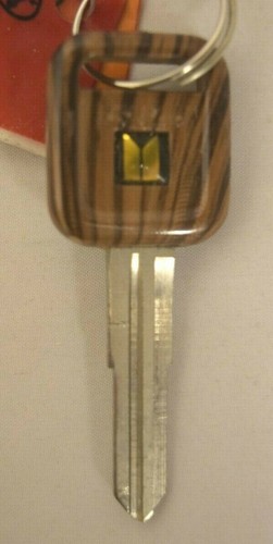 Plastic Head Faux Wood Look Key Older Model Isuzu B65 X184