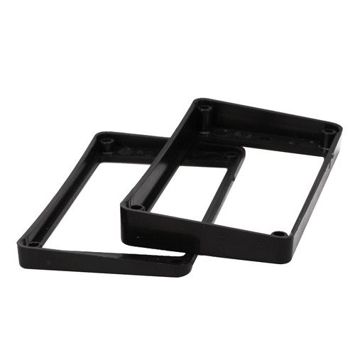 Der schwarze Humbucker Rahmen Pickup Rahmen umgibt Ringe für