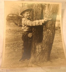 vintage-photo-young-boy-shooting-gun-holster-outfit