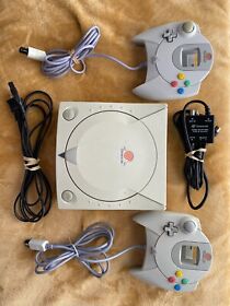Tested Dreamcast and two controllers.cleaned and returned to working order+games