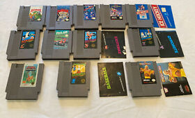 Lot of 12 NES games.  - Duck Hunt,  Gyromite, Rollerball Carts and some manuals
