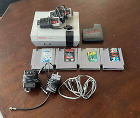 NES with 4 Games, Cables, 2 Controllers and Zapper