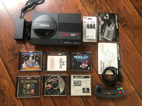 Commodore Amiga CD32 with one controller and 8 Authentic Games Great Condition