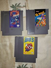 NES Super Mario Bros. 3, Q Bert, and Mega Man 3. VG+