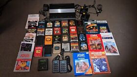 Atari 7800 system 25 Games,4 Controllers hook ups Tested to work excellent cond