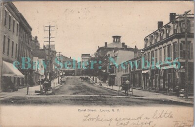 Lyons NY - STORE FRONTS ON CANAL STREET - Postcard Wayne County