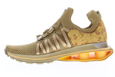 Nike shox gravity metallic gold deals