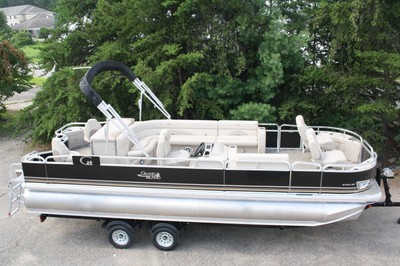 Storm damaged pontoon boat-motor trailer