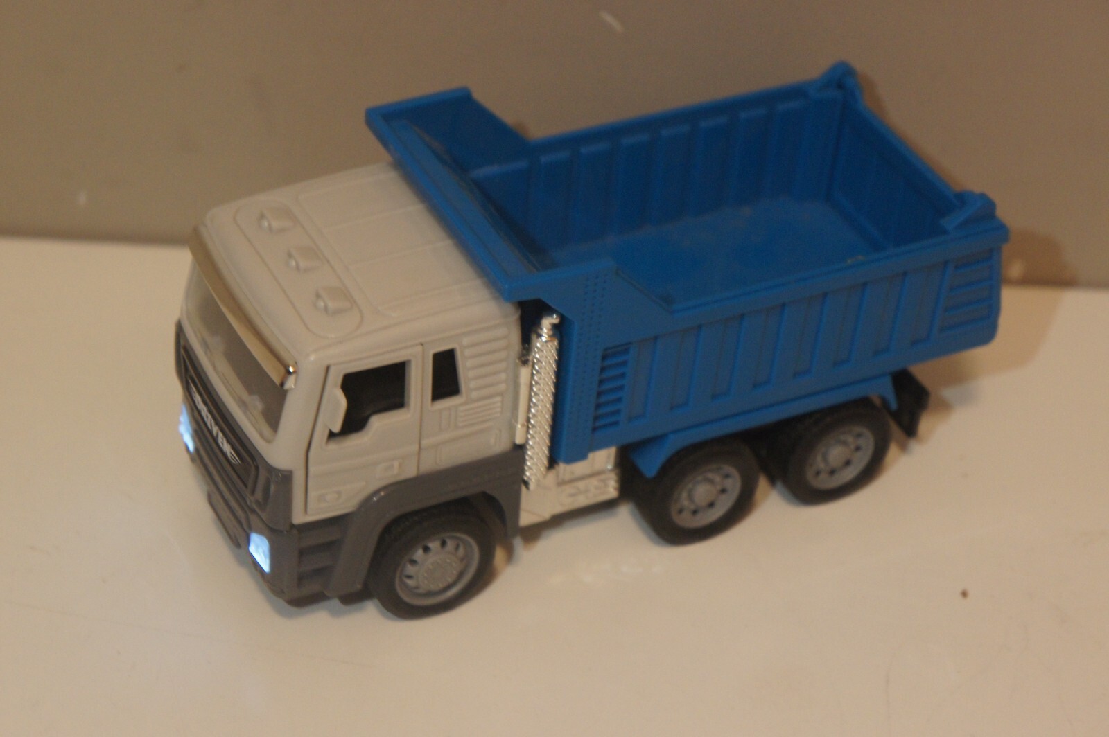 Driven by Battat Dump Truck BLUE Lights Up & Horn Sounds