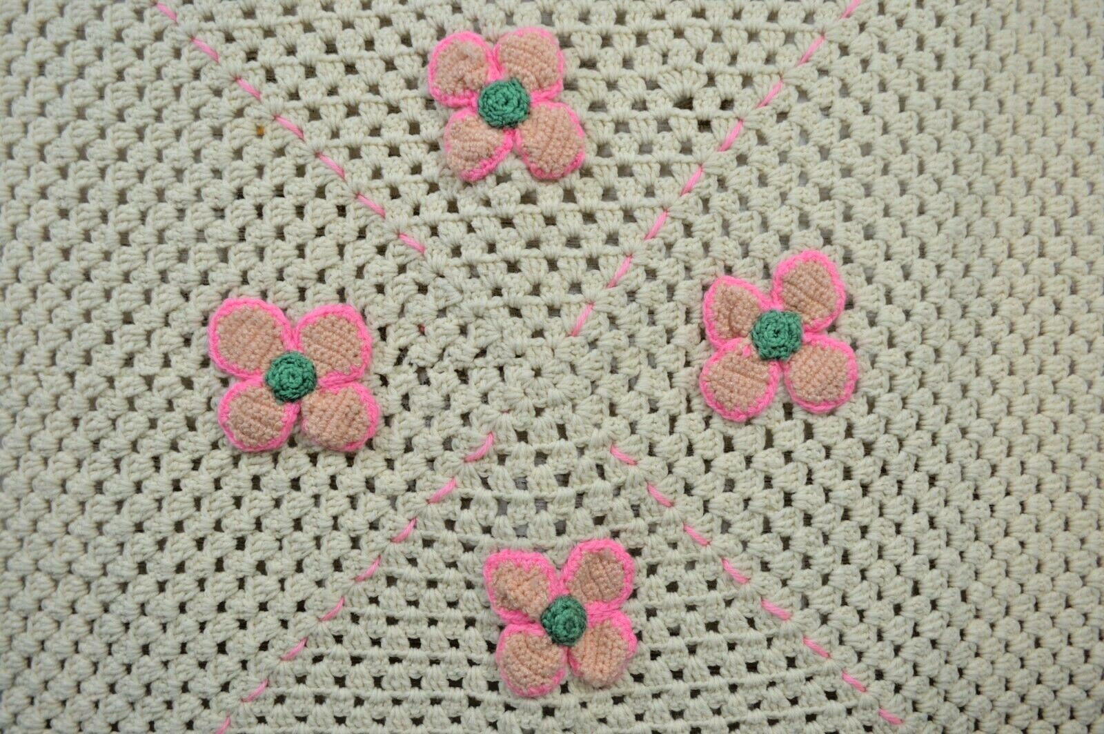 White and pink crocheted baby blanket afghan