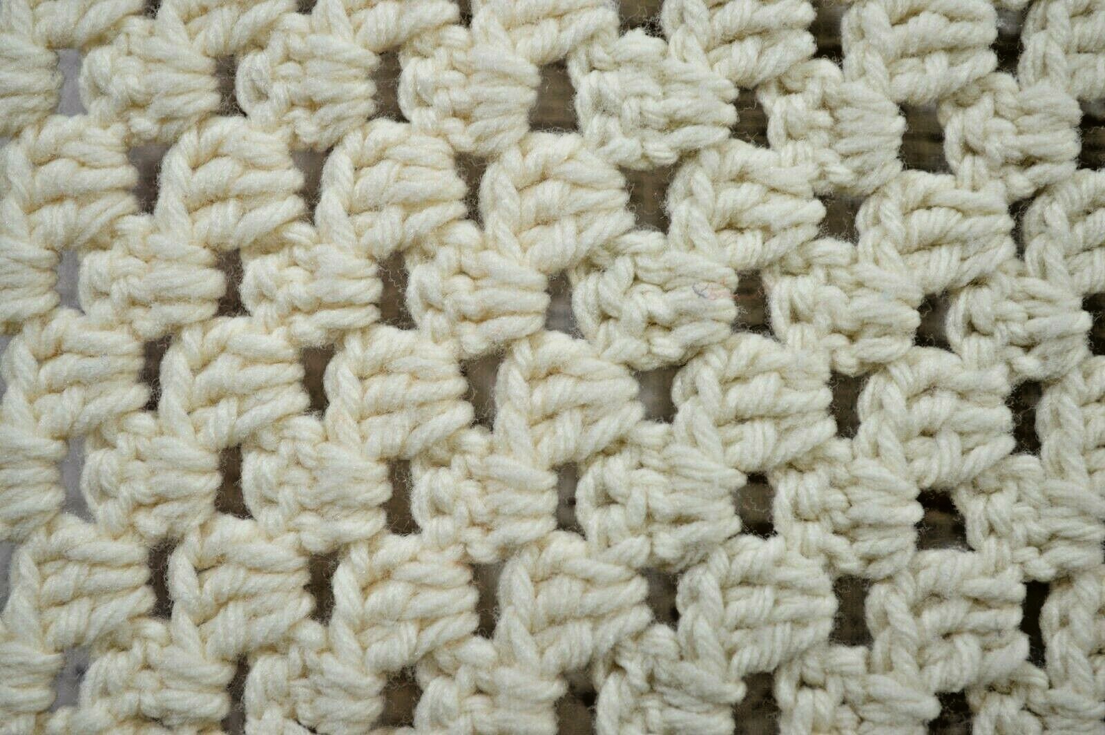 White and pink crocheted baby blanket afghan