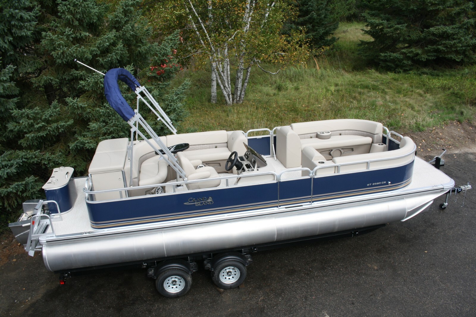 New Triple tube 25 ft Grand Island with 150 four stroke Mercury with trailer