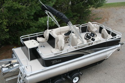 Triple tube new 1875 ft Quad Fish with 115 hp and bunk trailer.