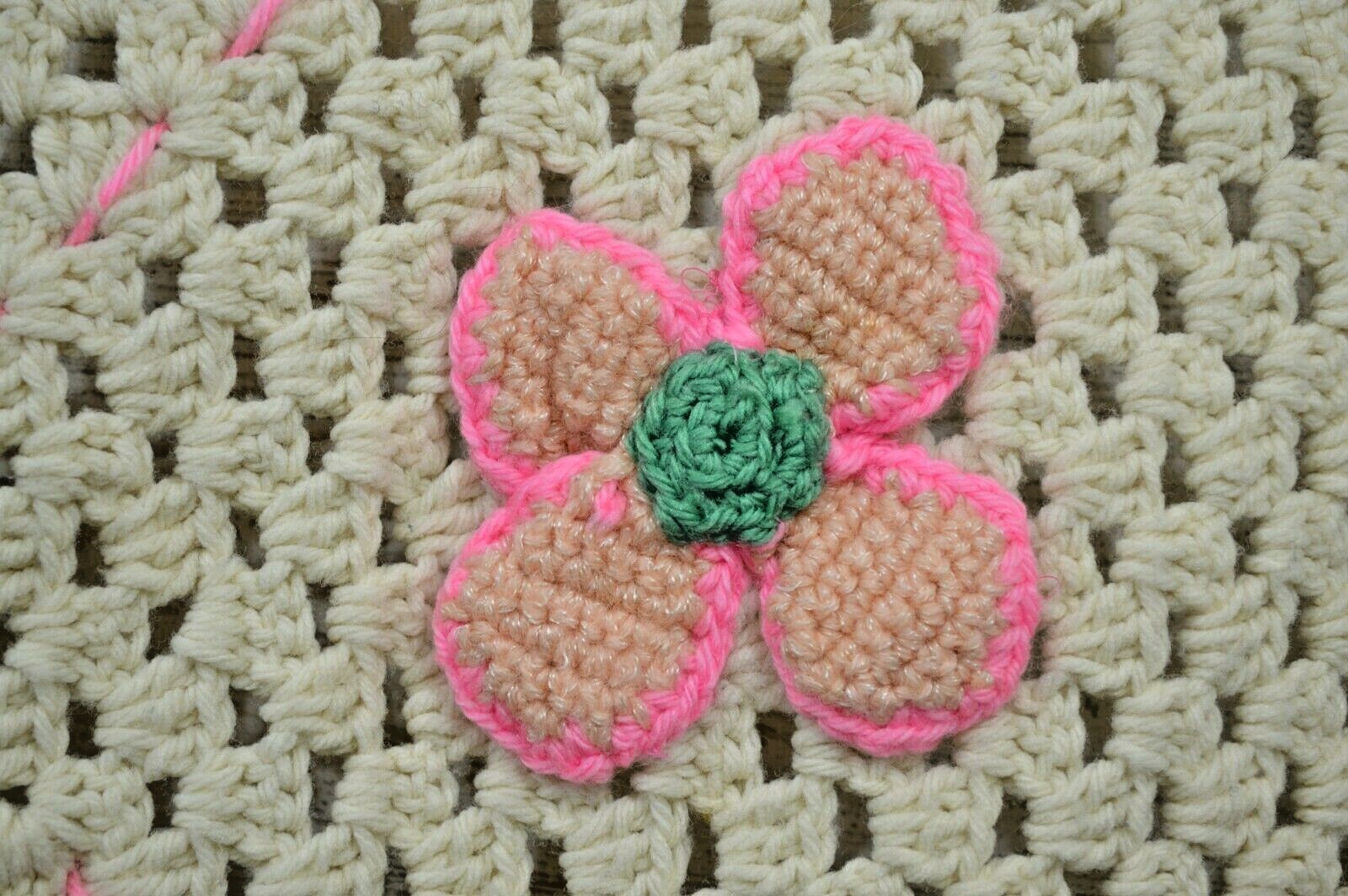 White and pink crocheted baby blanket afghan
