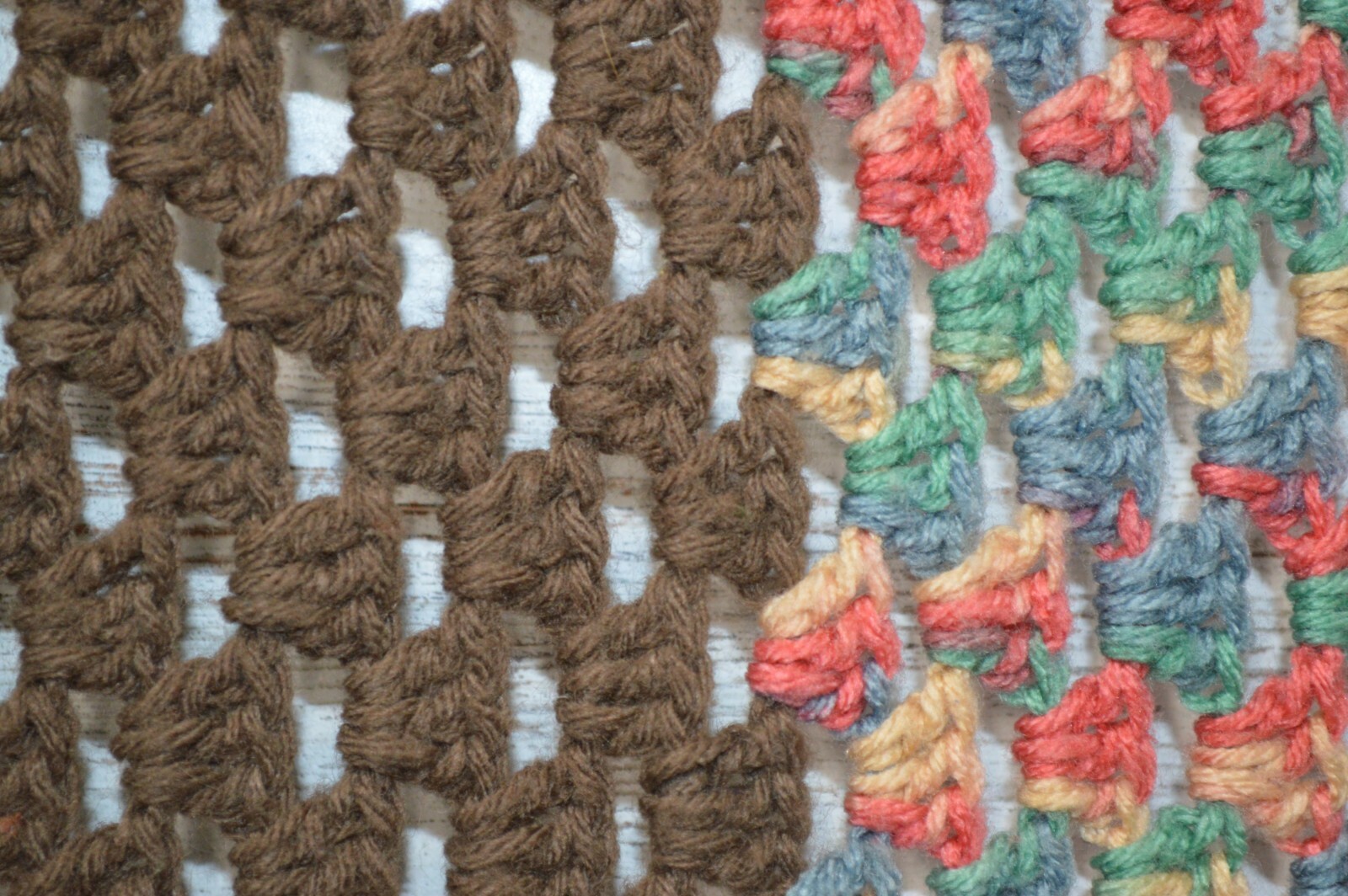 Brown, pink, green, blue and yellow crocheted blanket afghan