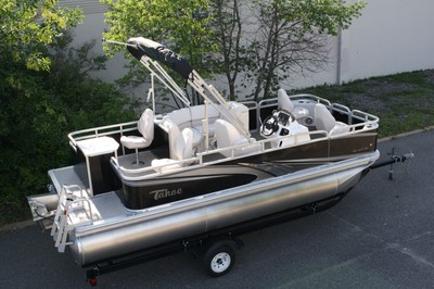1875 ft Quad Fish with 25 hp and single bunk trailer.