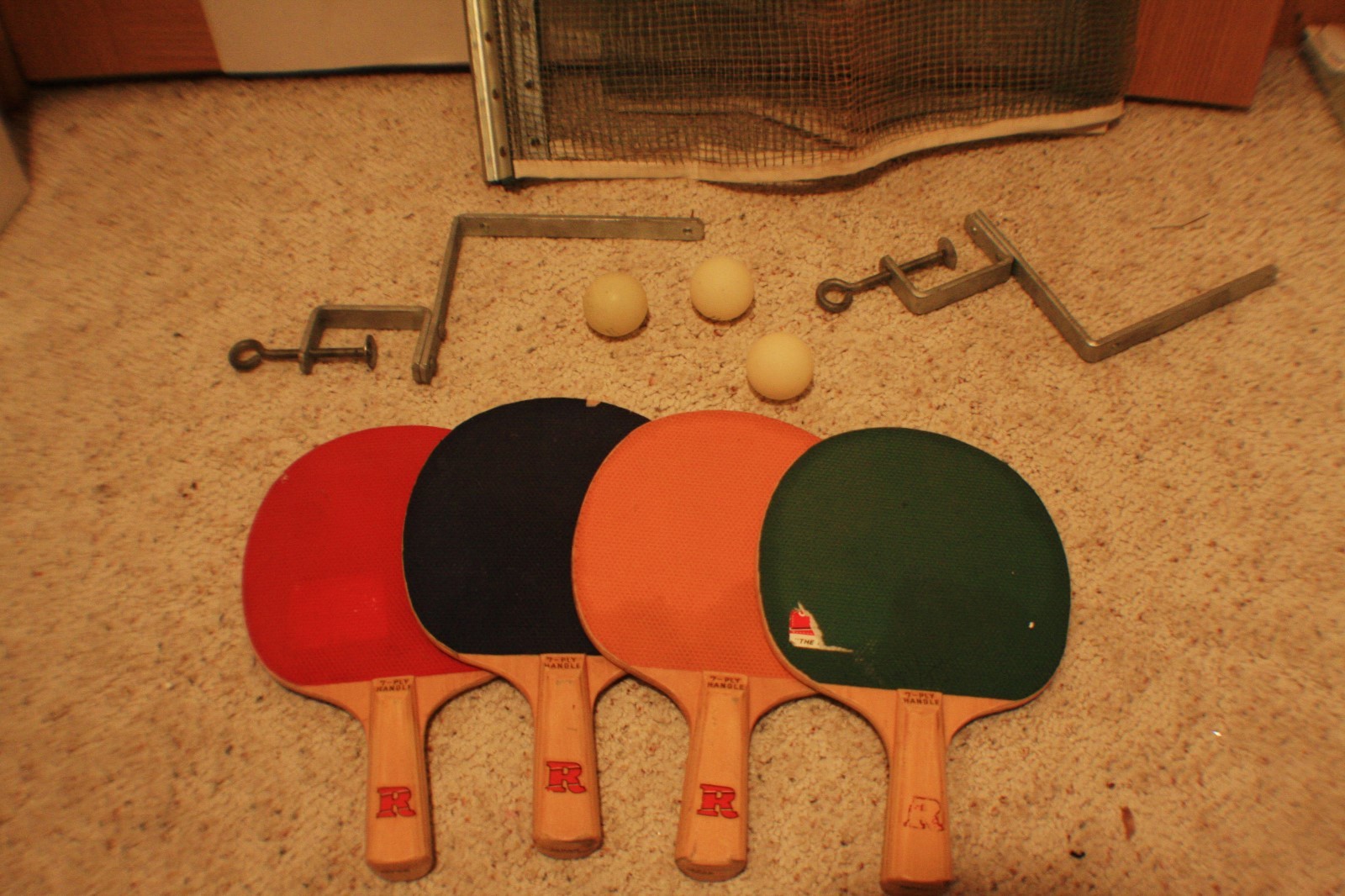 Vintage ping pong set with accessories: 4 Paddles, one net and  3 balls.