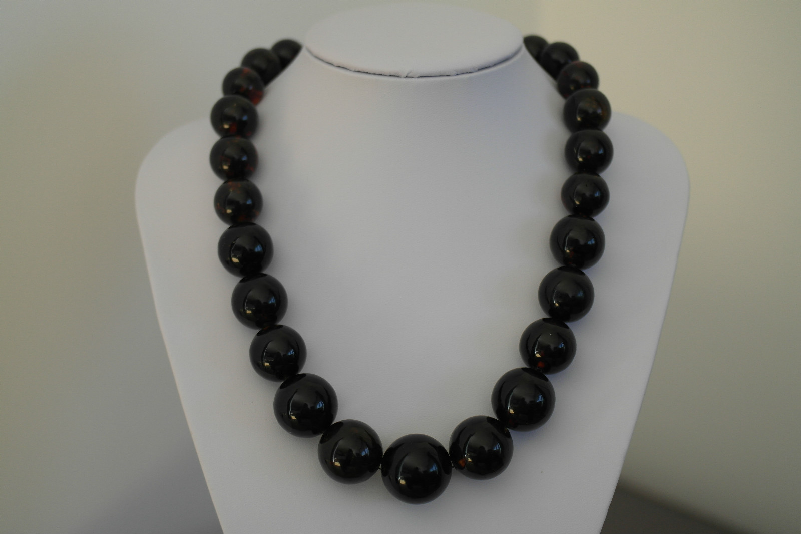 http://www.ebay.co.uk/itm/104-g-Baltic-dark-amber-round-graduated-beads-necklace-from-24-16mm-520mm-22-5-/171758685427