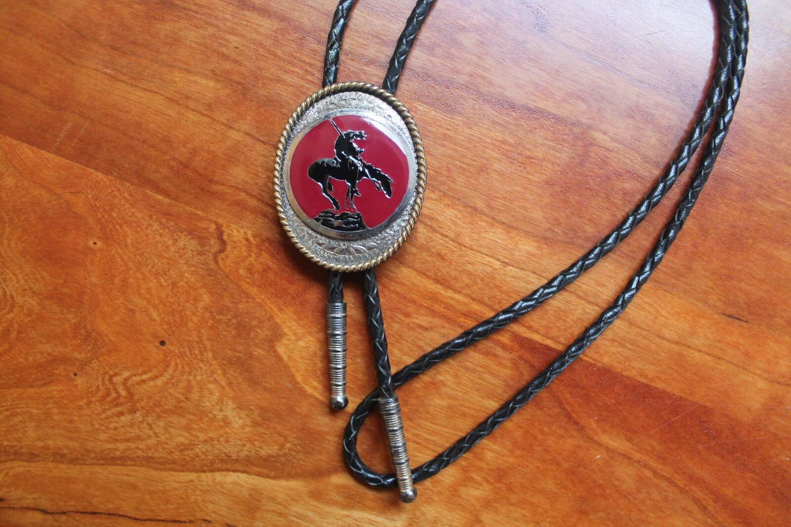 Western Men’s Bolo Neck Tie Metal Oval with Horse etched into a Red Background