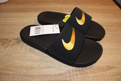 nike kawa slide black gold