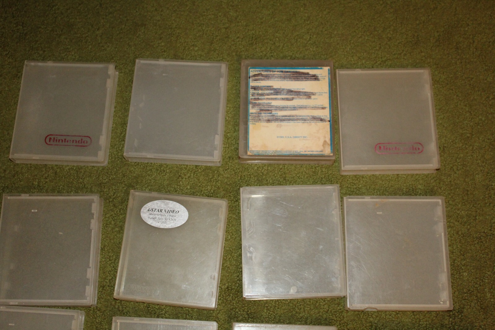 Lot of 22 NES Nintendo official hard plastic clamshell game cases clear rental