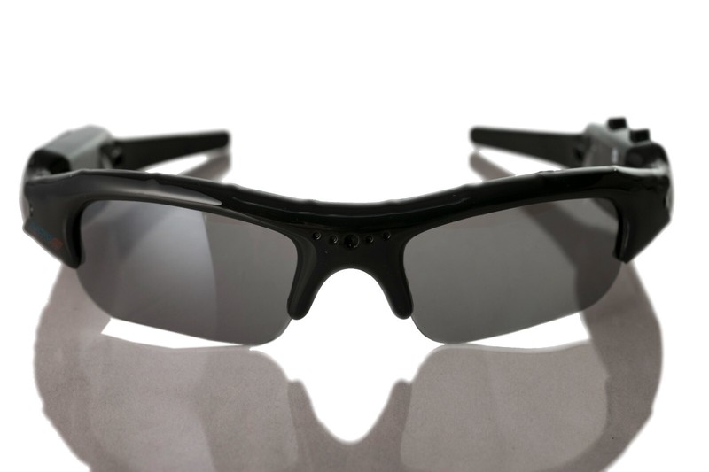 Black sport sunglasses with reflective lenses on white background.