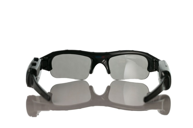 Black sports sunglasses on white background.