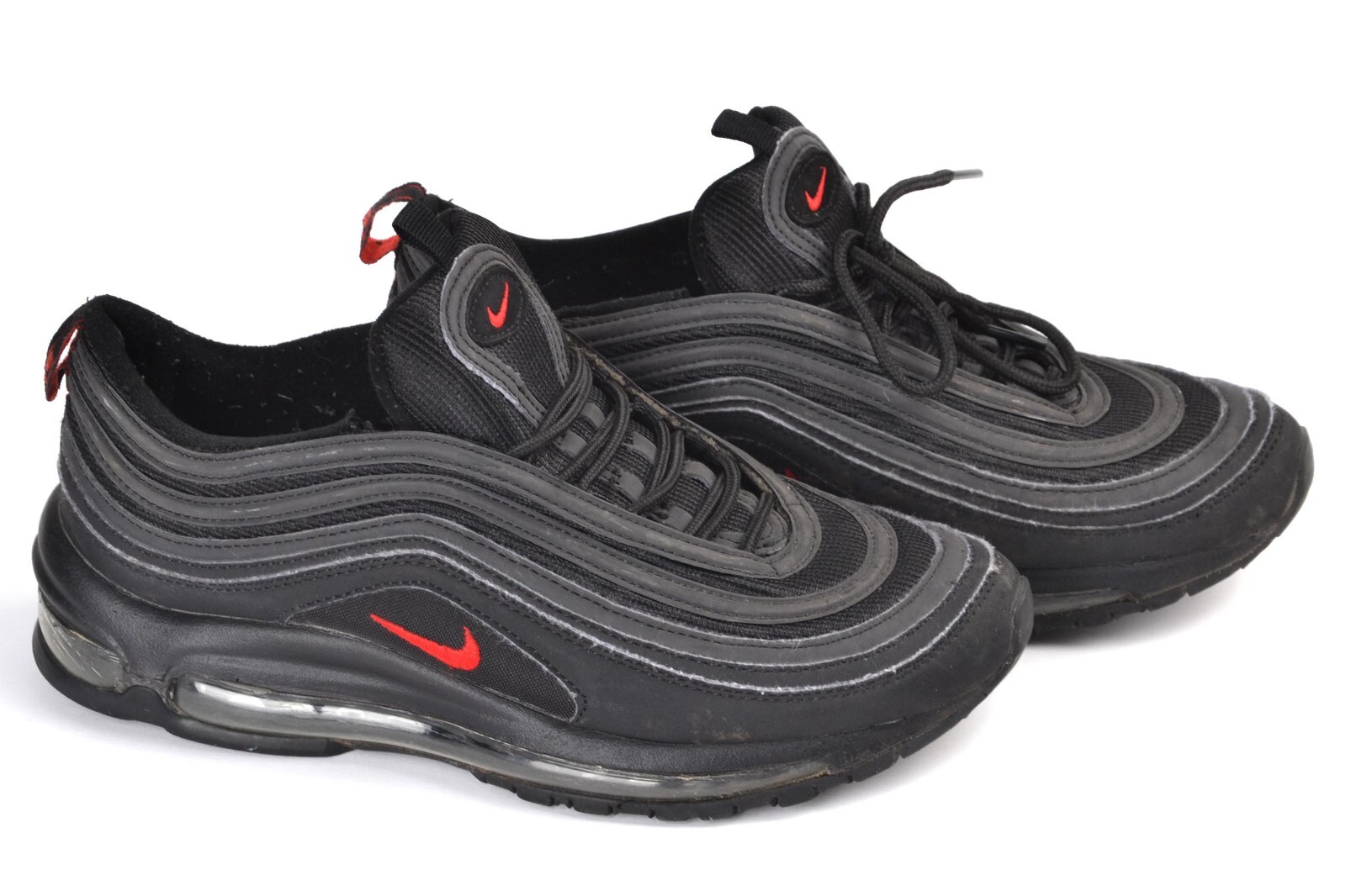 black nike shoes with red swoosh