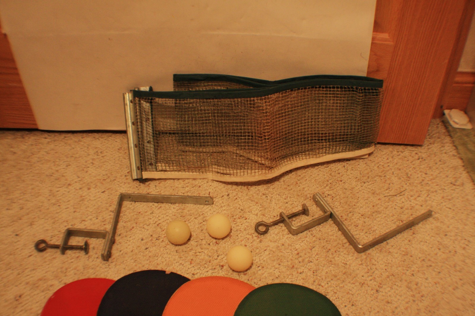 Vintage ping pong set with accessories: 4 Paddles, one net and  3 balls.