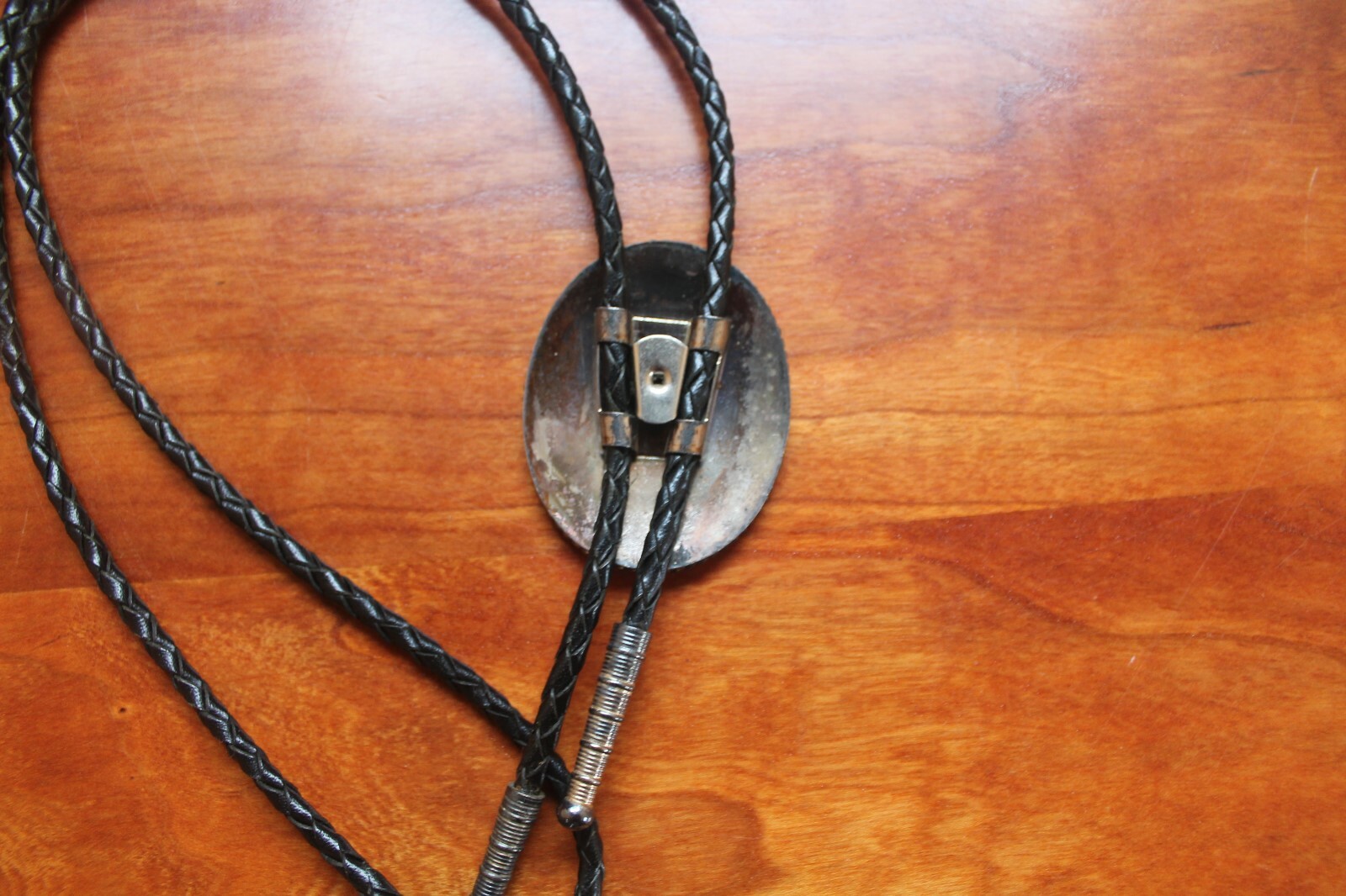 Western Men’s Bolo Neck Tie Metal Oval with Horse etched into a Red Background