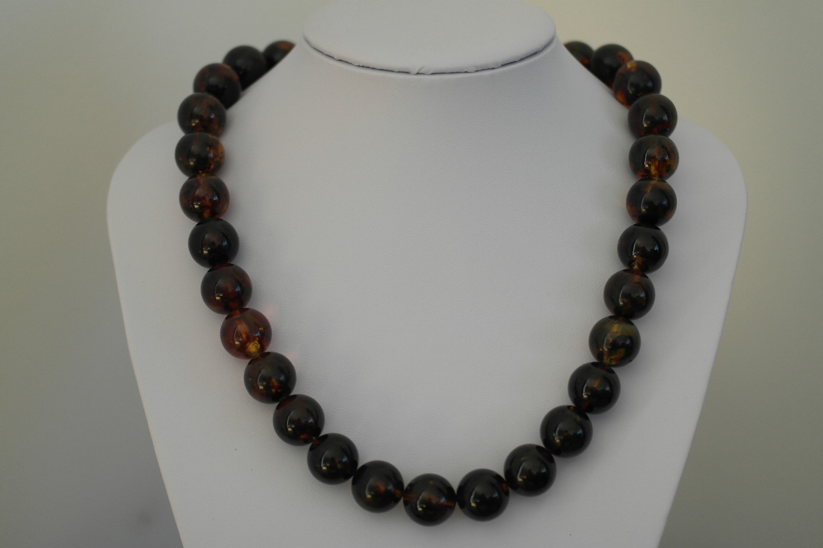 http://www.ebay.co.uk/itm/71-6-g-Baltic-dark-amber-round-beads-necklace-from-16-11-mm-540-mm-21-25-034-gift-/181720165982?