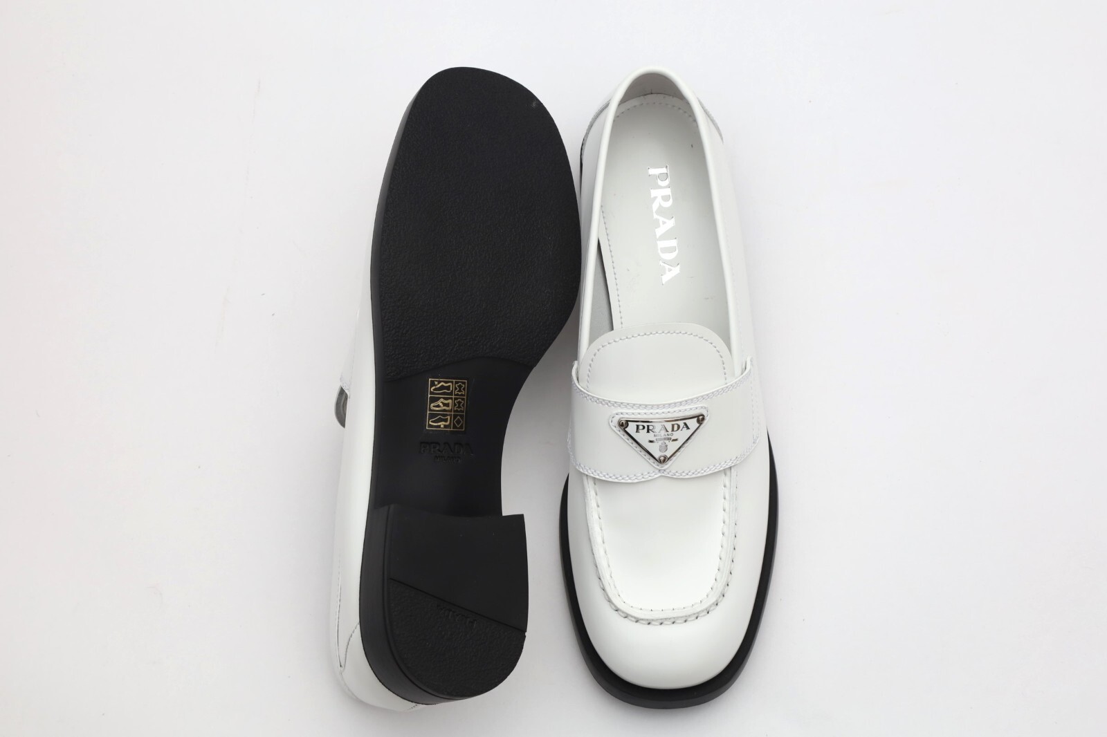 Prada Triangle Logo White Loafers Size 39.5/ US 9.5 in White Prada Triangle Logo White Loafers Size 39.5/ US 9.5 in White