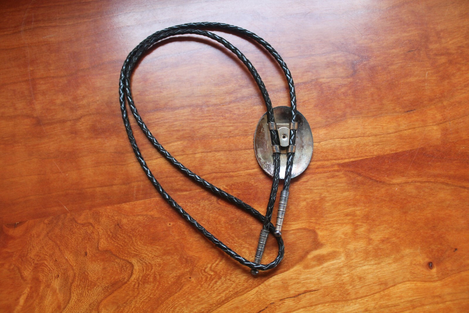Western Men’s Bolo Neck Tie Metal Oval with Horse etched into a Red Background
