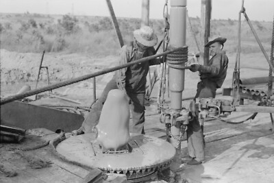 8'' x 10''  Adding a length of drilling pipe at oil well in Seminole oil field