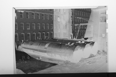(2) B&W Press Photo Negative Factory Building Yard Large Heavy Tanks - T5134