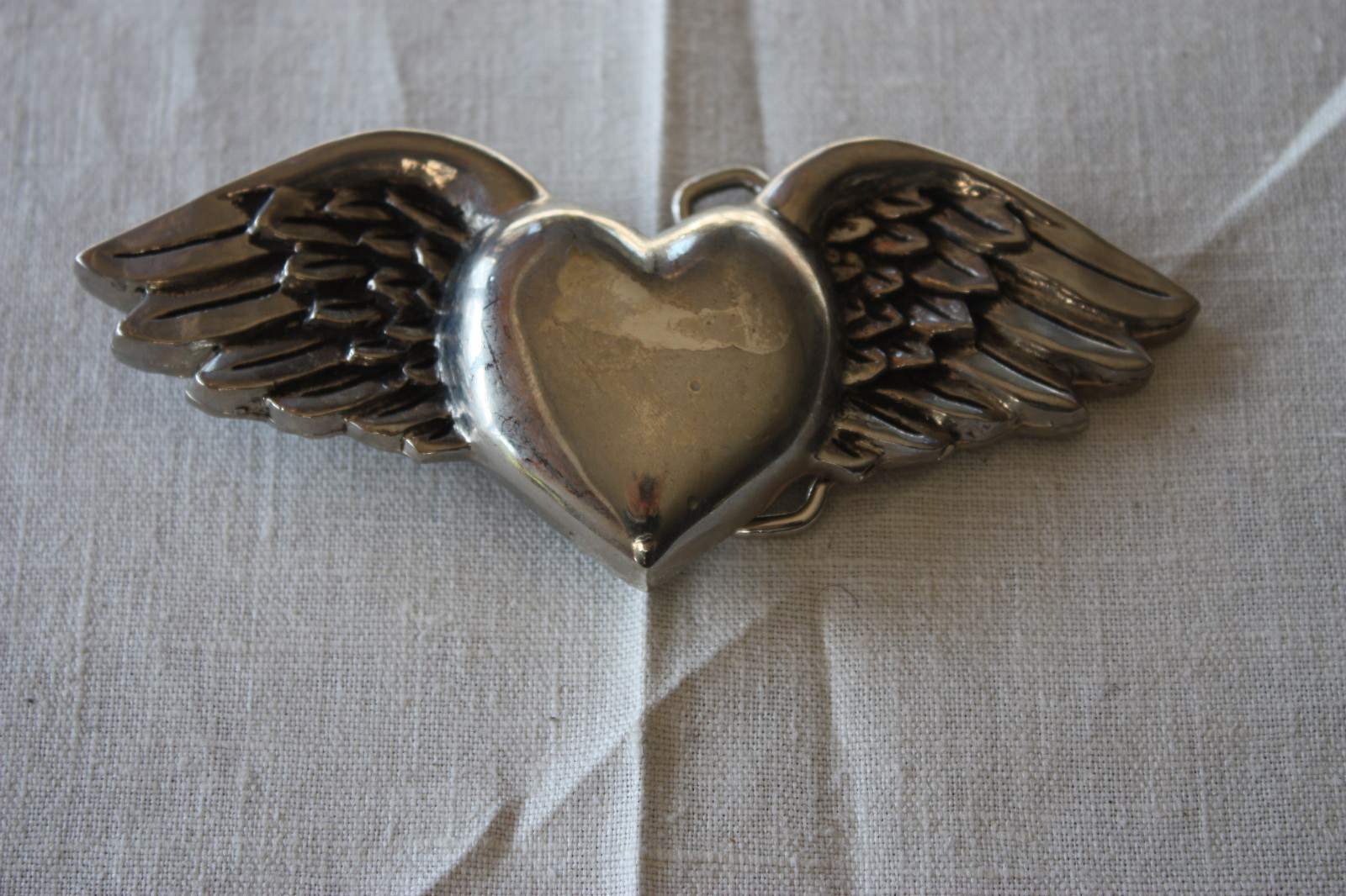 VINTAGE METAL BELT BUCKLE SILVER STAR WINGED HEART MARKED MADE IN THE USA 2004