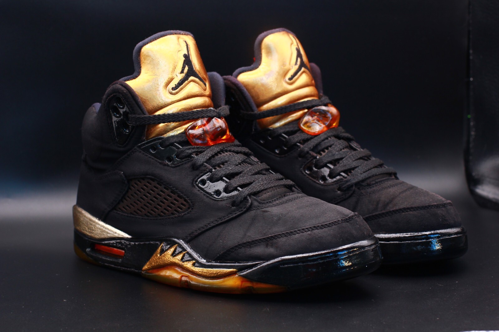 black gold jordan 5