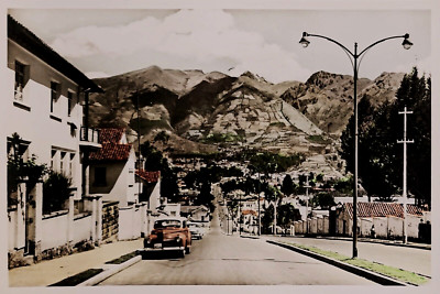 Real Photo RPPC in Color: Vintage Cars, Avenida Colon, Quito, Ecuador.