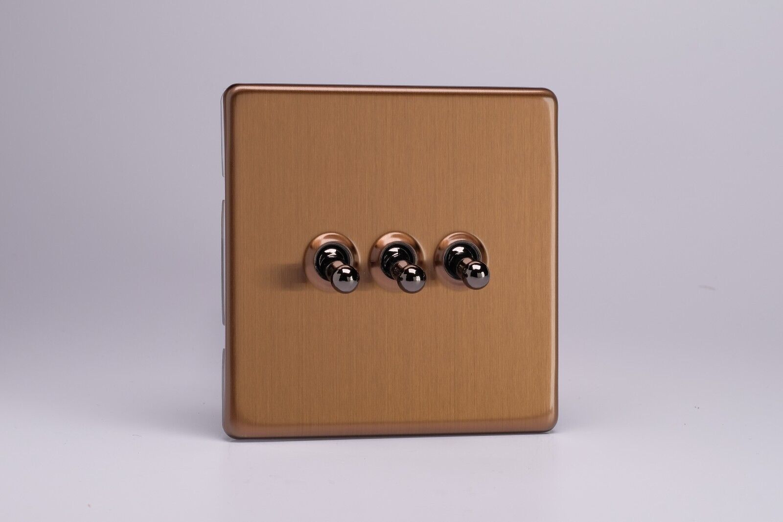 Varilight XDYT3S.BZ Screwless Brushed Bronze 3 Gang 1 or 2 Way Toggle Switch Varilight XDYT3S.BZ Screwless Brushed Bronze 3 Gang 1 or 2 Way Toggle Switch